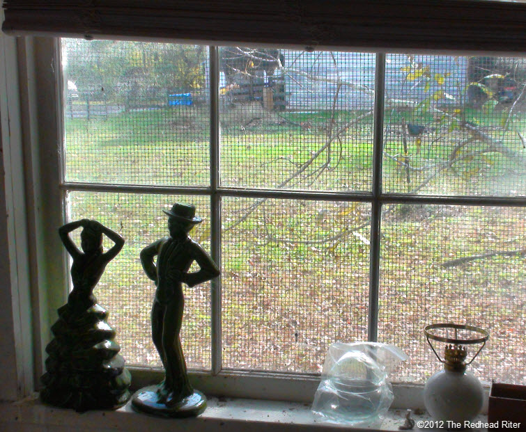 couple statue old farm window