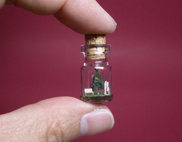 green christmas tree in a tiny bottle