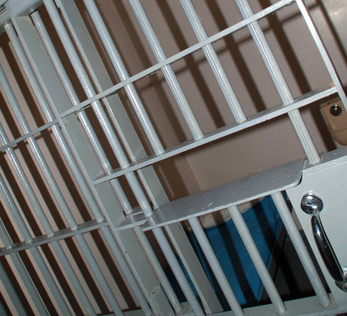 jail cell gray bars cot