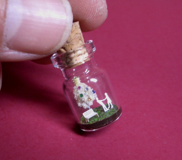 white christmas tree in a tiny bottle