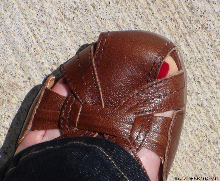 brown sandal red toenail pavement