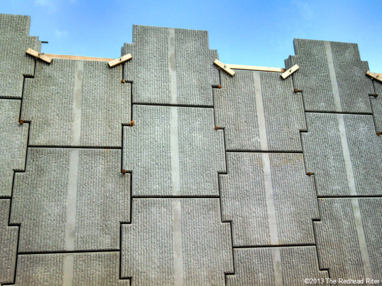 gray tall thick concrete wall blocks
