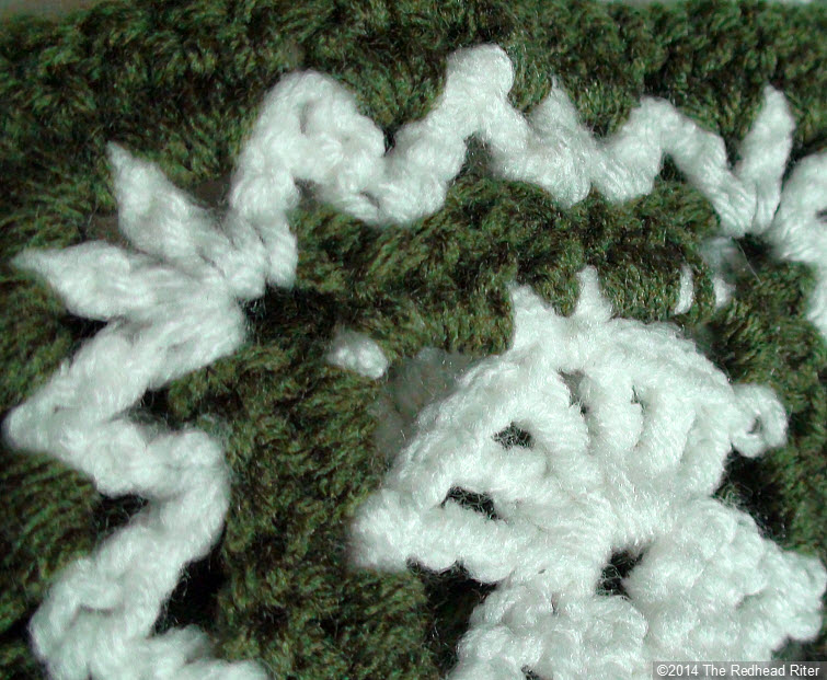 crocheted afghan green cream closeup