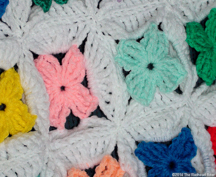 crocheted afghan multi color flower closeup