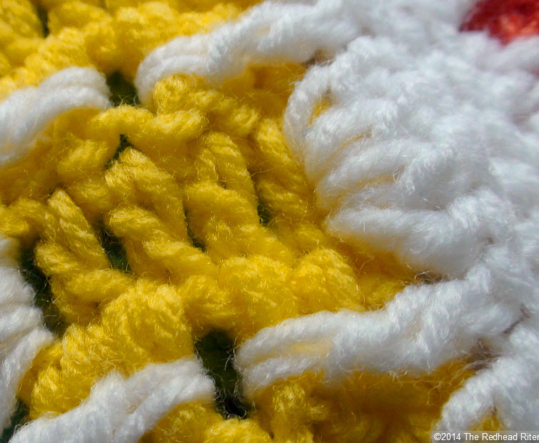 crocheted afghan yellow stitches closeup